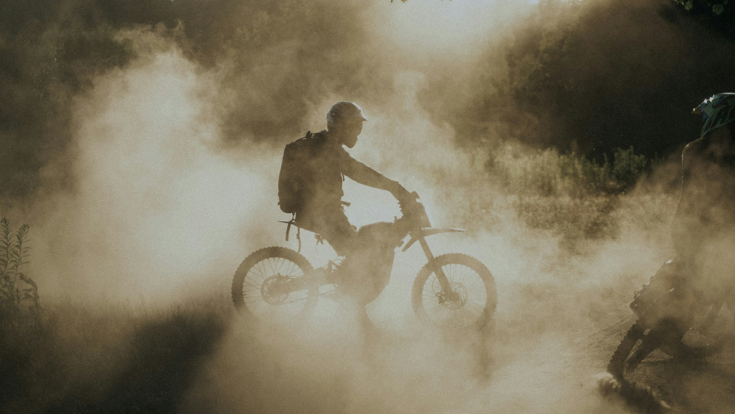 Fasthouse — motocross rider through dust