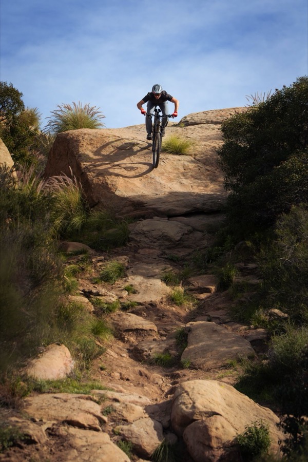 Fasthouse MTB rider on rocky trail